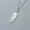 feather shaped silver locket